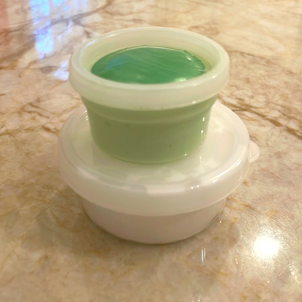 Green christmas themed slime with clay and charms